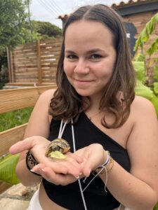 faustine holds baby tortoise near Gerakas Beach