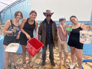 Conservation volunteers cleaning fish tanks