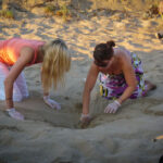 volunteer in zante zakynthos Greece with sea turtles on the beach with eggs